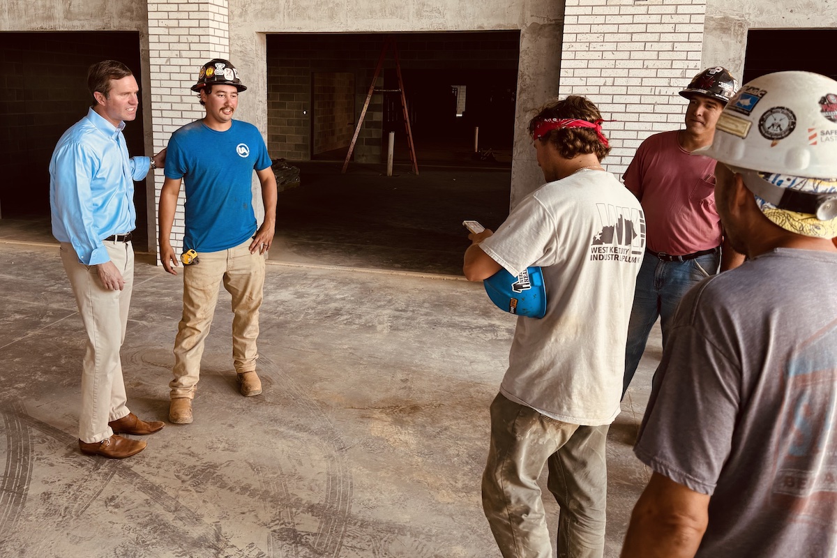 Gov. Andy Beshear speaks with construction workers Wednesday, Sept. 11, 2024, at the consolidated high school they are building. It will combine Hopkinsville and Christian County high schools, and the districts vocational, into one campus. (Hoptown Chronicle photo by Jennifer P. Brown)