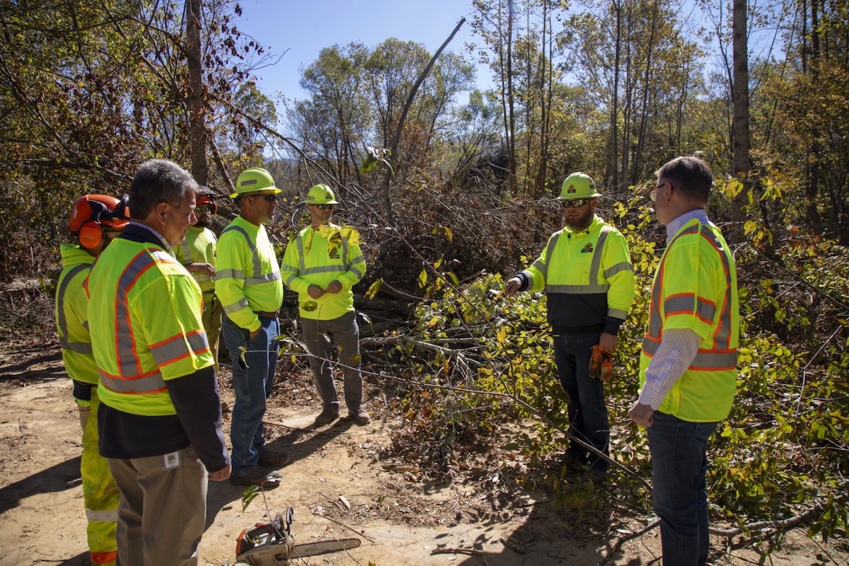 Kentucky Transportation Secretary Jim Gray (right) speaks with workers from the commonwealth who are working in North Carolina. (Kentucky Transportation Cabinet photo)