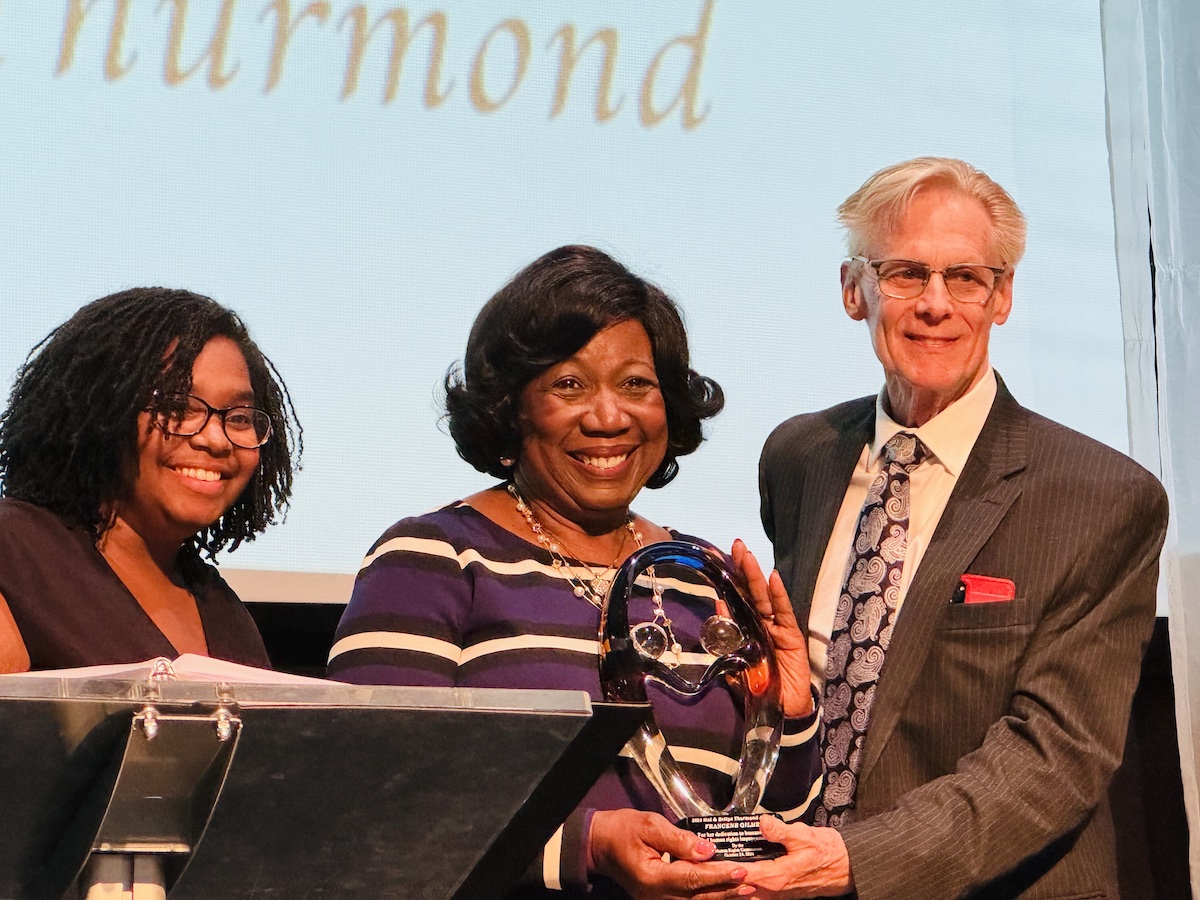 Francene Gilmer (center), receiving the 2024 Hal and Bettye Thurmond Award, is flanked by Raychel Farmer, executive director of the Human Rights Commission of Hopkinsville-Chrisitian County, and David Thurmond, who presented the award named for his late parents. (Hoptown Chronicle photo by Jennifer P. Brown)