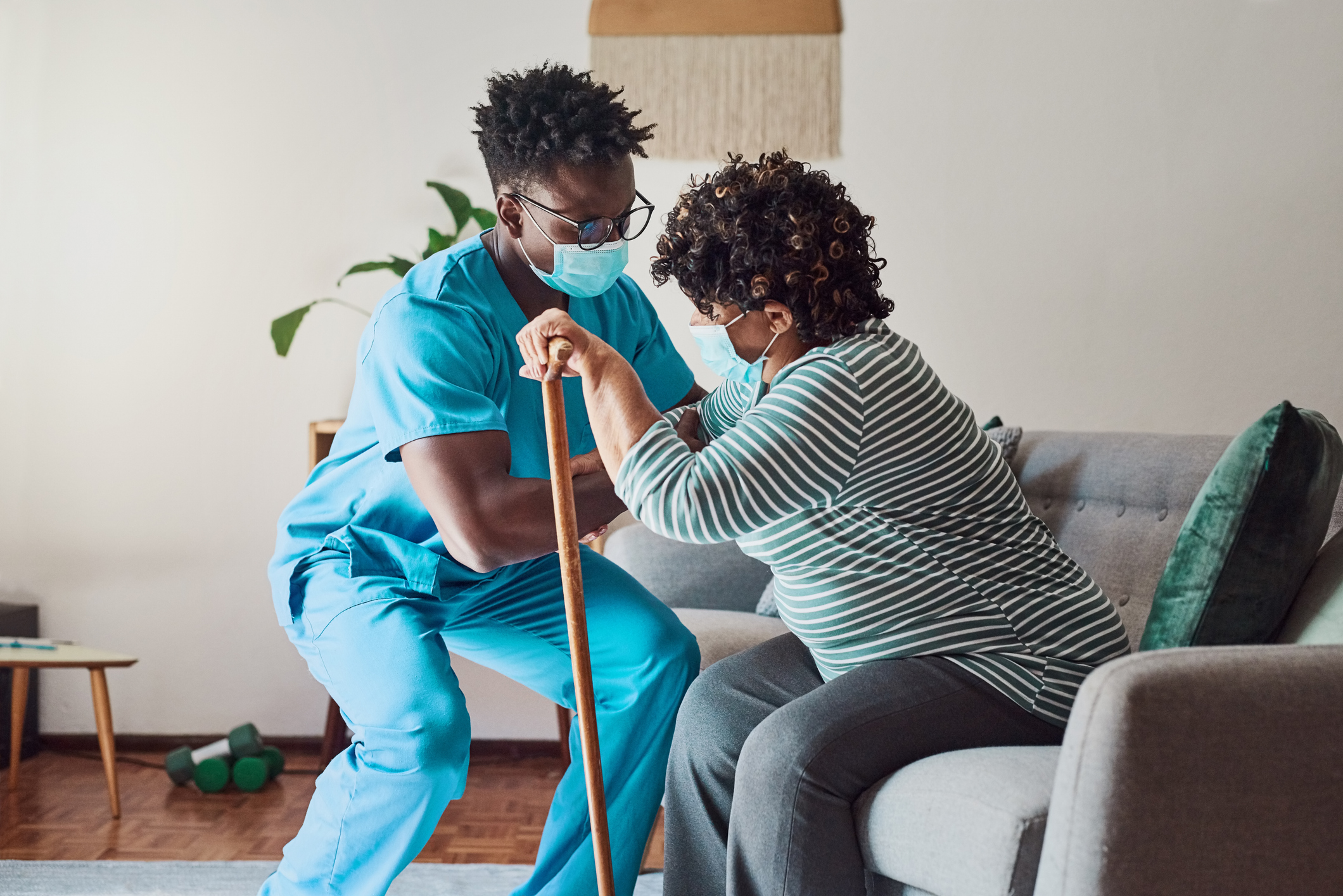 nursing home staff helping resident