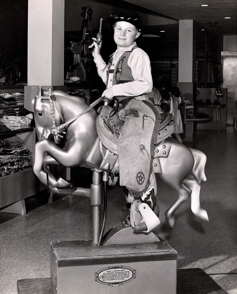 William B. Mason Jr. riding a mechanical horse