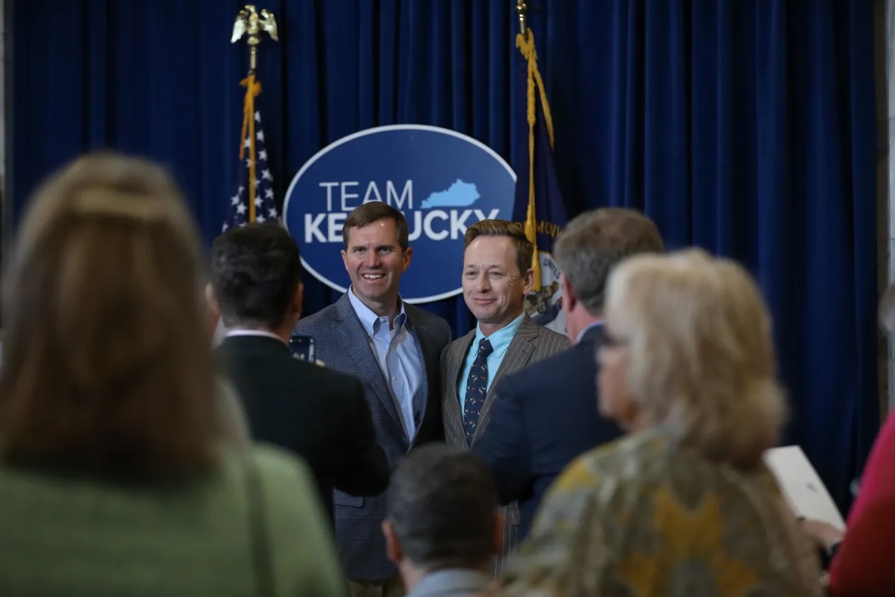 Kentucky Governor Andy Beshear (left) and Silas House at a ceremony in late April during which the Governor appointed Whitley County native and award-winning author as the 2023-24 Kentucky Poet Laureate. (Source: Governor Andy Beshear Flickr)