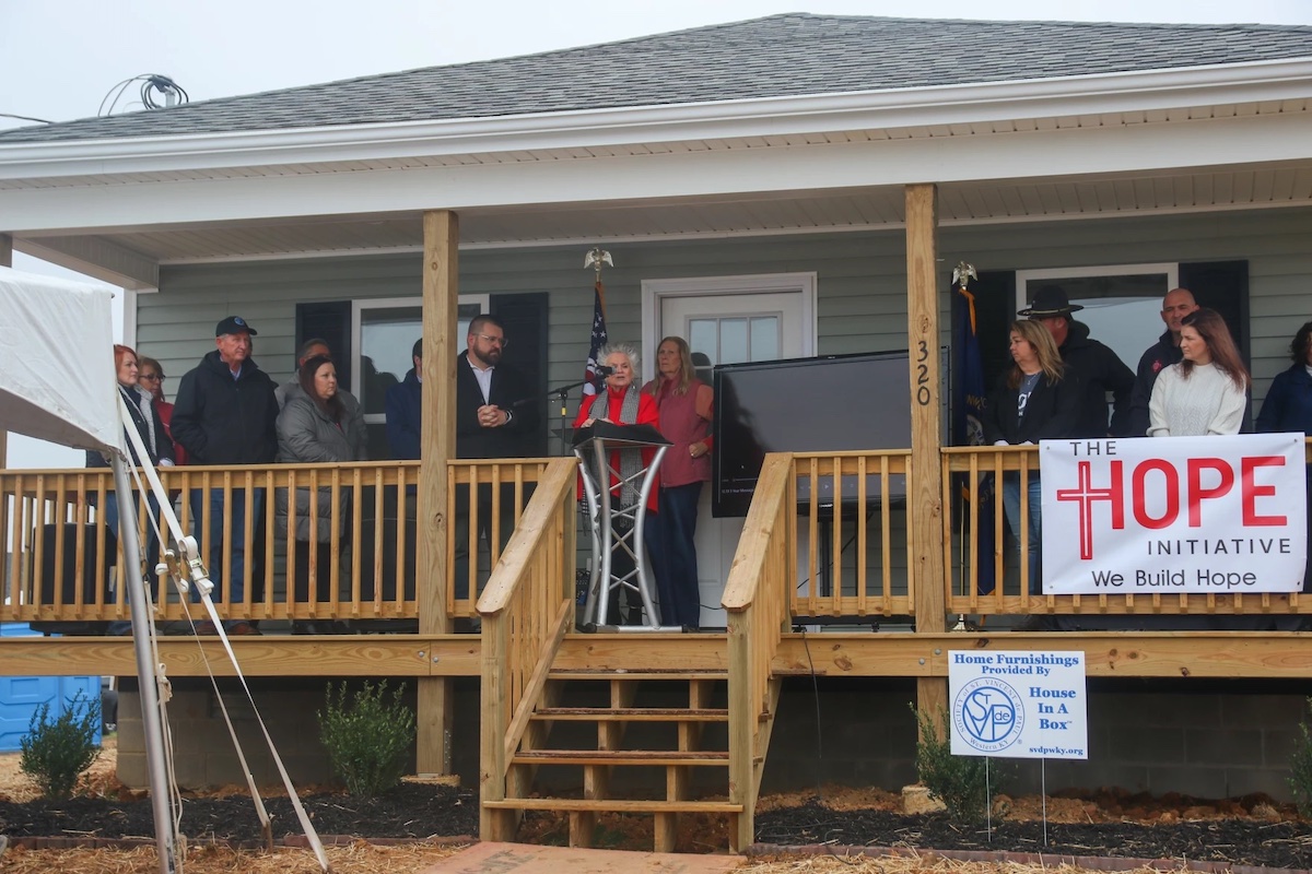 Officials for Mayfield and Graves counties joined community members Tuesday to recognize the third anniversary of the EF-4 tornado that hit the region. They awarded keys to eight new homes for tornado survivors. (WKMS photo by Hannah Saad)