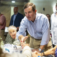 andy beshear shaking hands