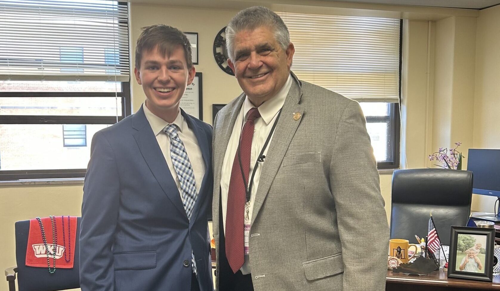 Alex Young, left, a college student from Louisville and vocal opponent of corporal punishment, posed with Rep. Steven Riley, a retired educator and Republican from Glasgow, who has tried a number of times to get the legislature to ban the practice. (Photo provided)