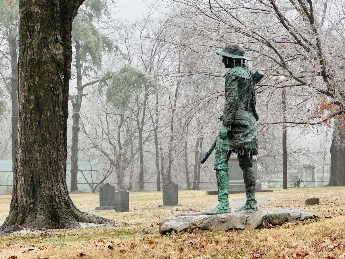 Icicles hang from Pioneer, a 1984 copper statue by Steve Shields, on Sunday, Jan. 5, 2025, in Pioneer Cemetery. (Hoptown Chronicle photo by Jennifer P. Brown)