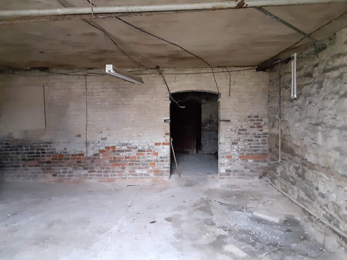 The basement of the Dalton house on East Seventh Street. This room might have been were laundry was washed by hand. (Photo by Grace Abernethy)