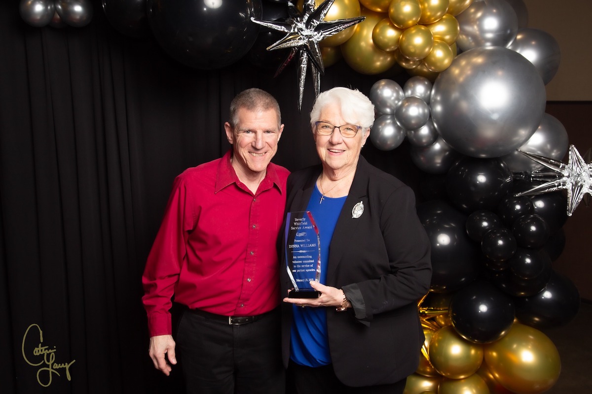 Donna Williams poses with Curt Anderson, executive director of the Aaron McNeil House, after she received the Beverly Whitfield Award at the United Way of the Pennyrile campaign celebration Tuesday, Feb. 25, at the James E. Bruce Convention Center. (United Way photo by Cat Lacy)