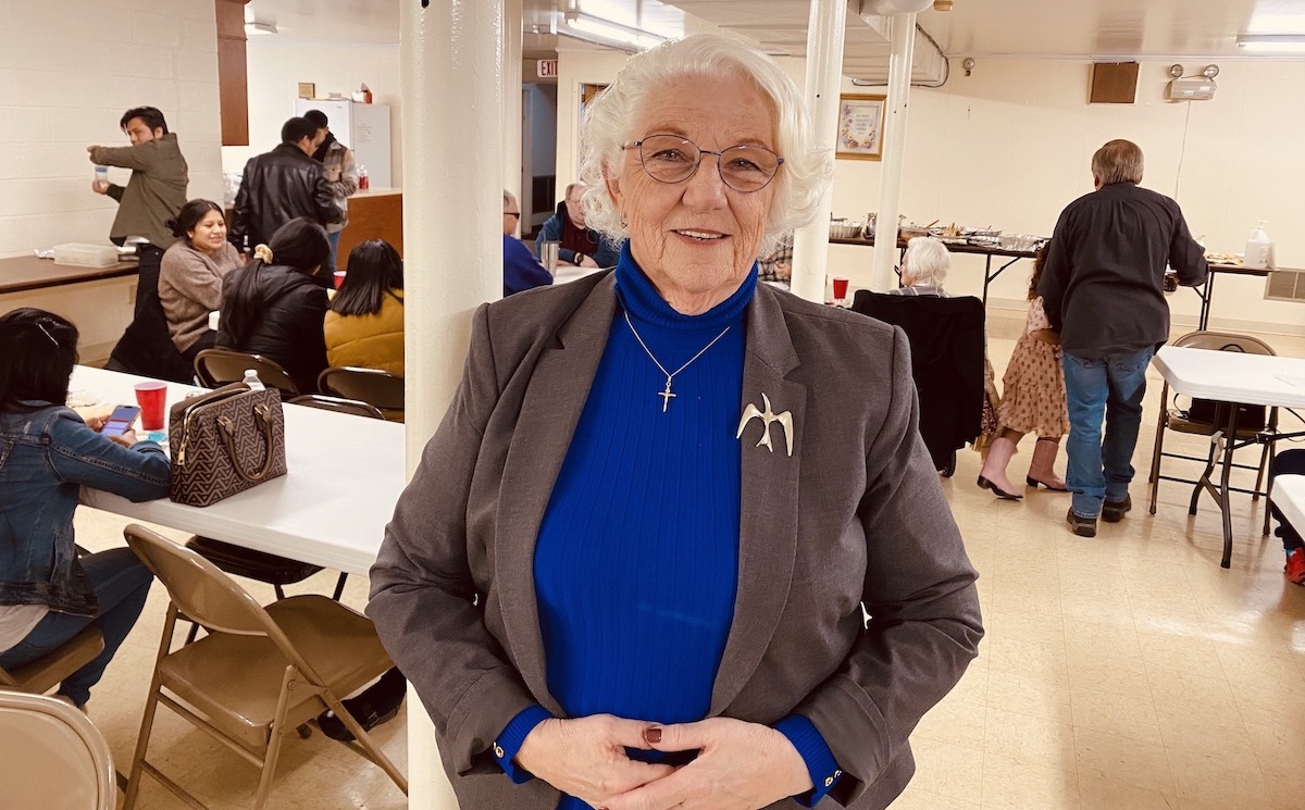 Pastor Donna Williams stands in the basement fellowship hall of Christian Heights United Methodist Church, where congregants were sharing a Thanksgiving potluck meal on Nov. 20, 2022. (Hoptown Chronicle photo by Jennifer P. Brown)