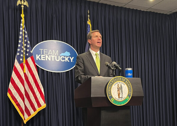Gov. Andy Beshear at podium