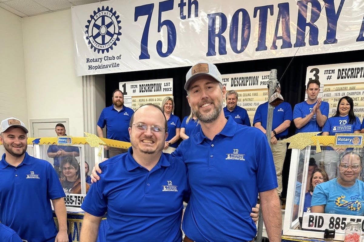 Hopkinsville Rotarians Brett Pritchett (left) and Landan Stallons celebrate a big finish Saturday evening for the 75th Hopkinsville Rotary Auction. Landan chaired this year's auction, and Pritchett will chair next year. (Hopkinsville Rotary photo)