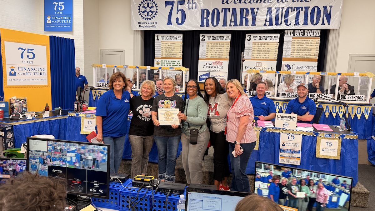 women gathered at rotary auction
