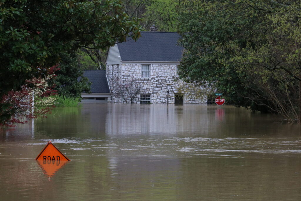 house submerged by floodwaters