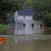 house submerged by floodwaters