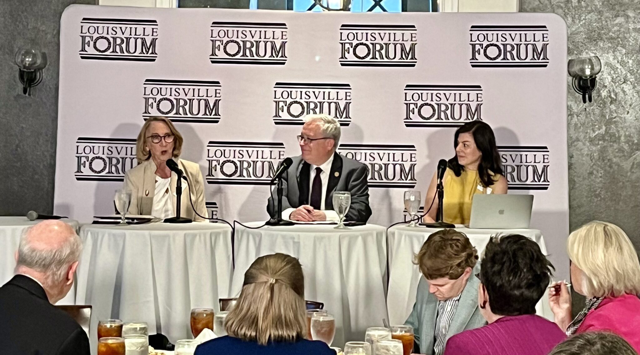 From left, journalist Deborah Yetter, Jim Waters of the Bluegrass Institute for Public Policy Solutions and Emily Beauregard of Kentucky Voices for Health discuss Medicaid during a gathering of the Louisville Forum, May 15, 2025. (Kentucky Lantern photo by Sarah Ladd)
