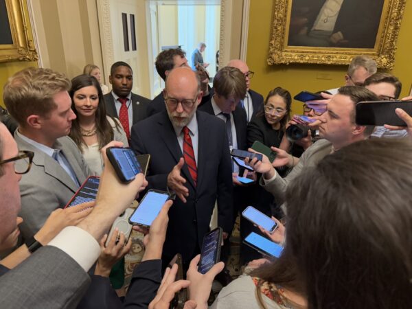 reporters surrounding budget director