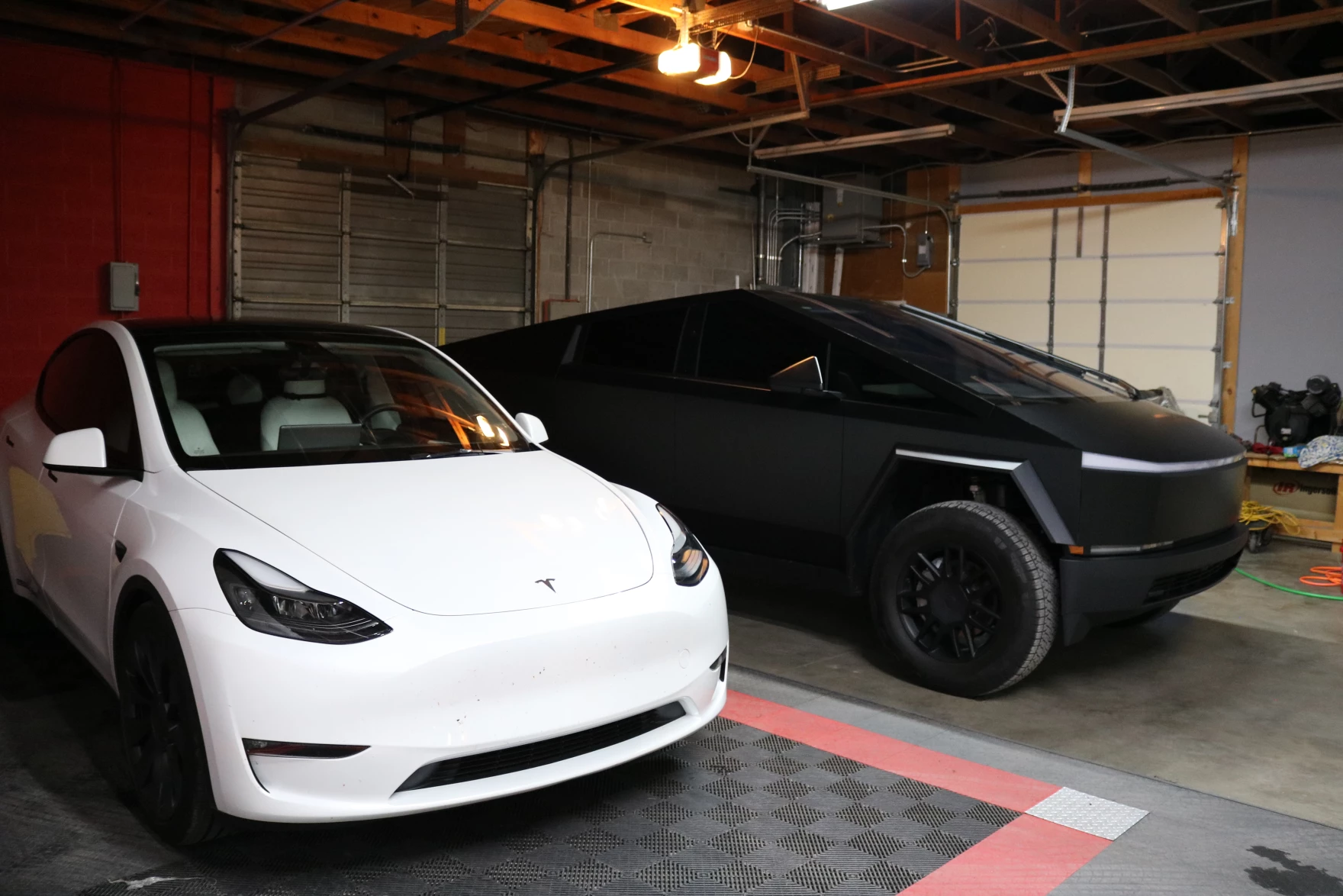 Mark and Pam Glover, business owners in Paducah, own two electric vehicles, both Teslas. They're a part of the growing population of EV owners in Kentucky. (Photo by Lily Burris | WKMS)