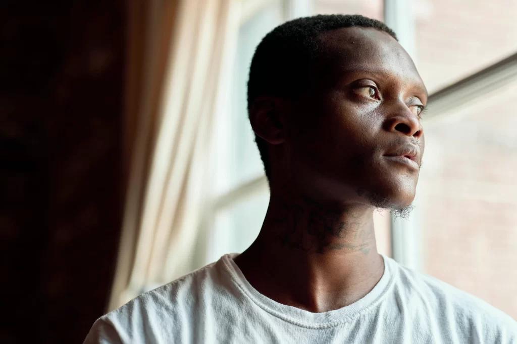 Larry Black Jr. looking out window