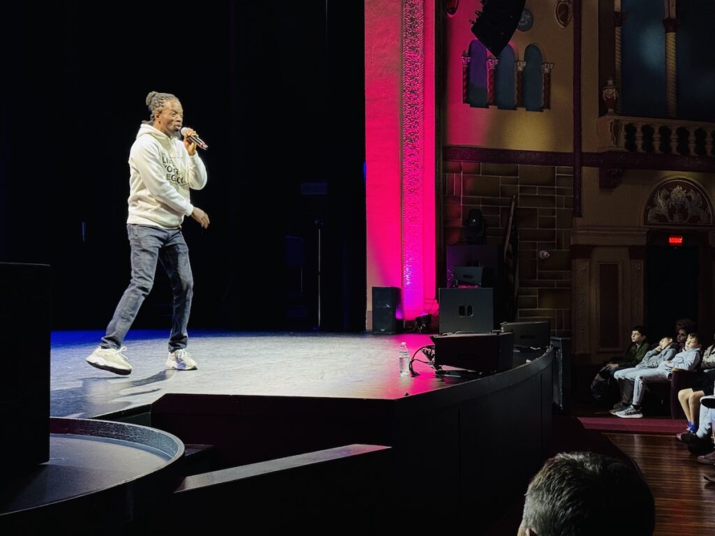 man on stage with a mic