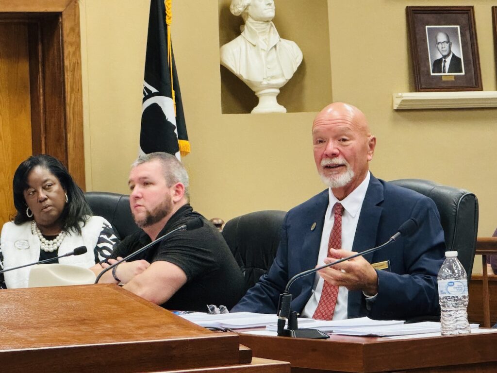 two men and women sitting at table