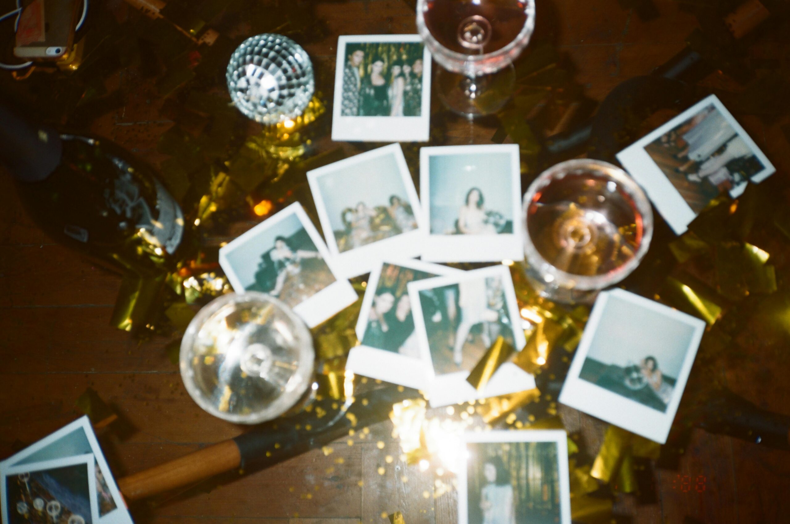 polaroid photos surrounded by holiday decorations