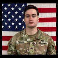 Benjamin Pennington in front of United States flag