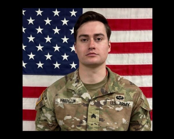 Benjamin Pennington in front of United States flag