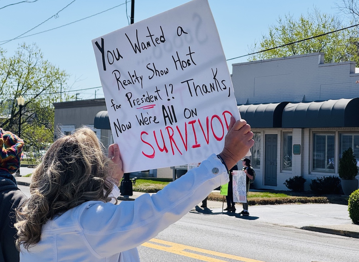 Participants in Hopkinsville's No Kings rally on Saturday, March 28, 2026, waved signs at passing vehicles along West Ninth Street. (Hoptown Chronicle photo by Jennifer P. Brown)