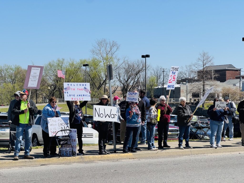 people holding protest signs