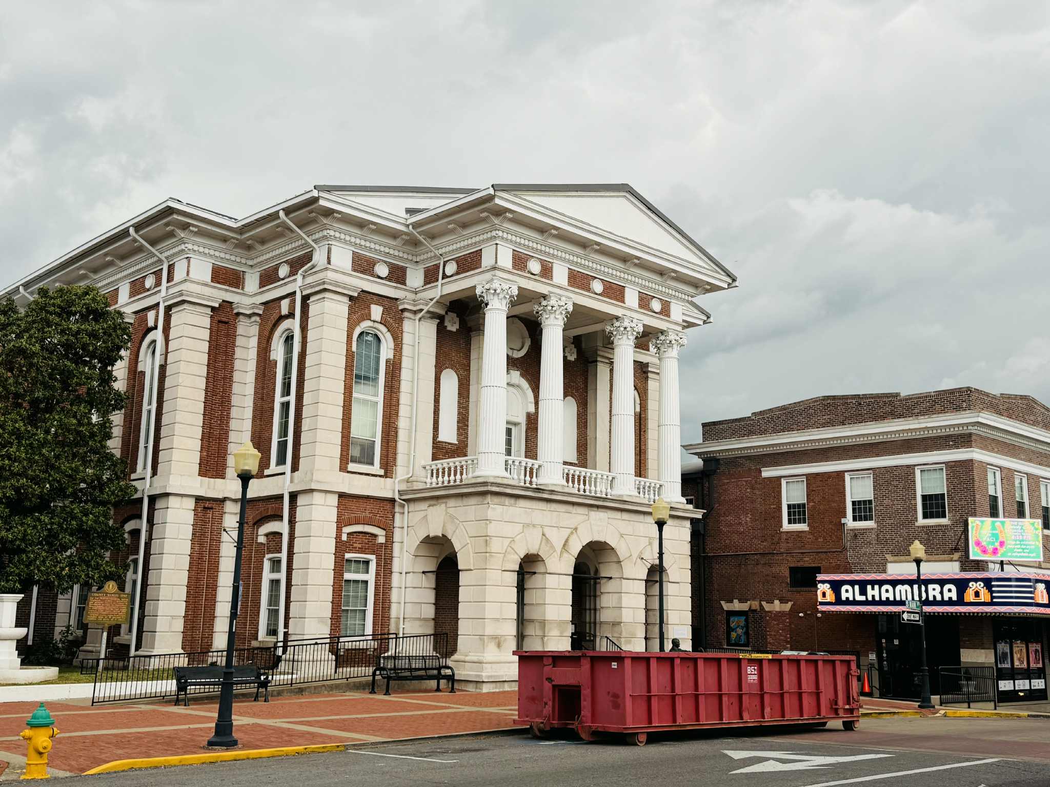 trash container in front of christian county courthouse
