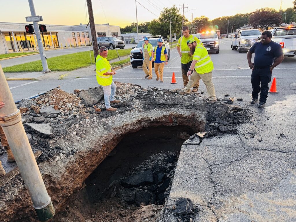 large deep hole in pavement