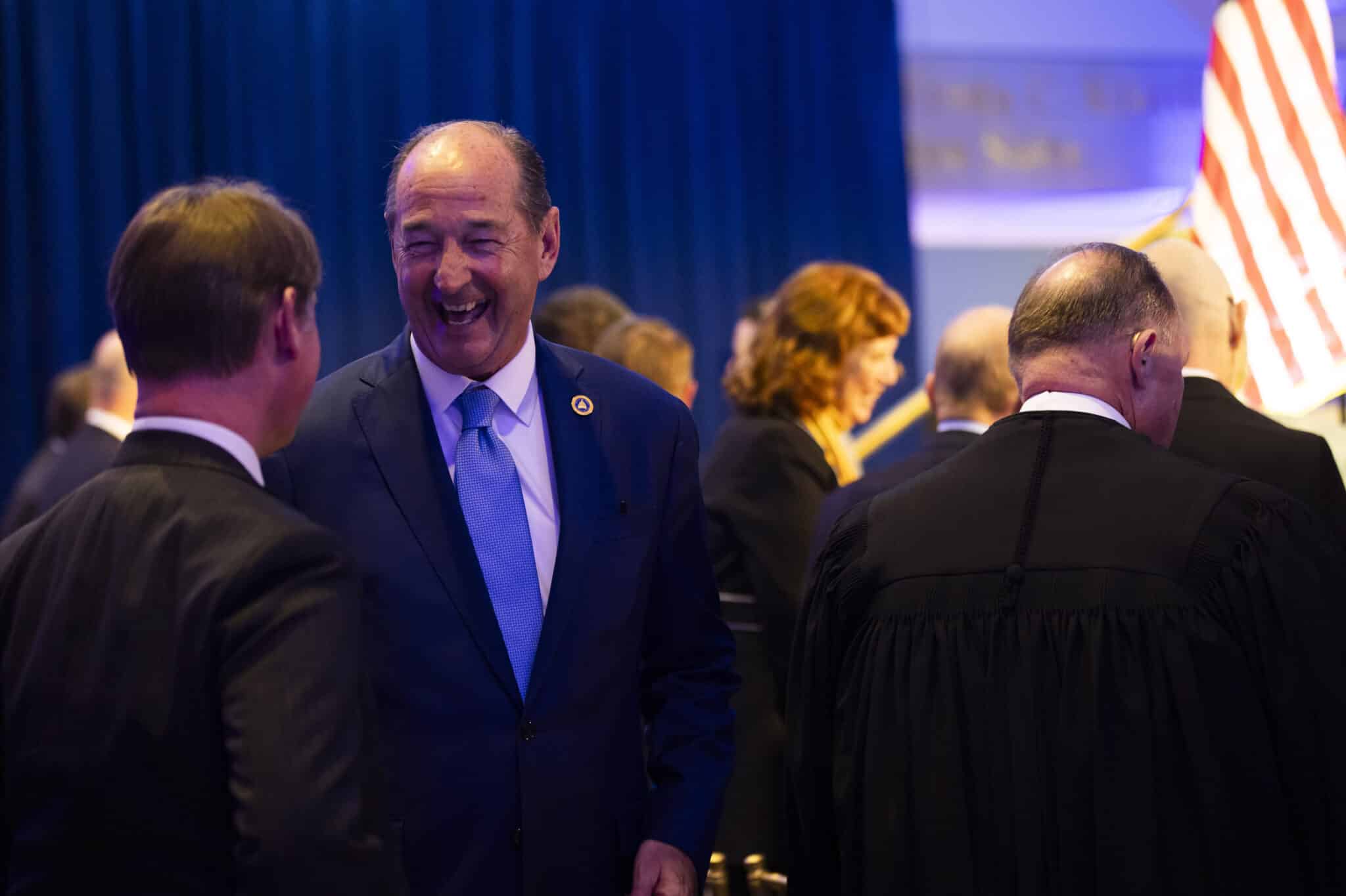 Rocky Adkins speaks with Kentucky Secretary of State Michael Adams before the State of the Commonwealth address at the Thomas D. Clark Center for Kentucky History in Frankfort, Kentucky, on Jan. 7, 2026. Photo by Arden Barnes for the Kentucky Lantern