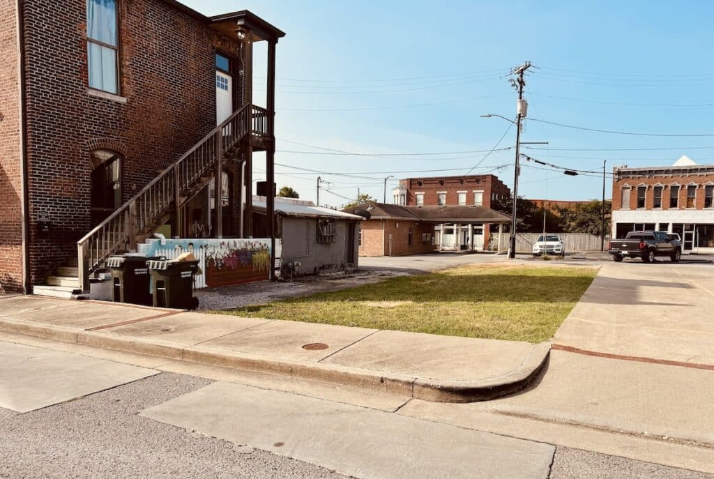 empty lot surrounded by streets and buildings