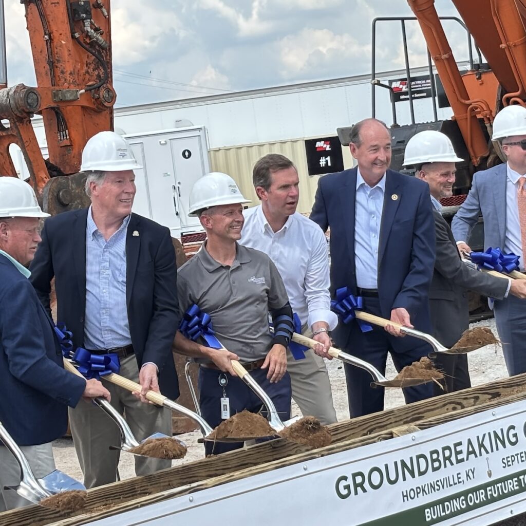 men holding shovels at groundbreaking