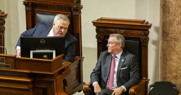 Kentucky Senate President Robert Stivers speaks to Speaker of the House David Osborne during the State of the Commonwealth address Jan. 3 in Frankfort. (Kentucky Lantern photo by Arden Barnes)