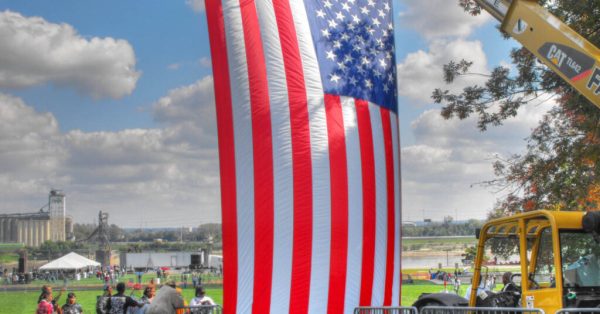 forklift holding an American flag