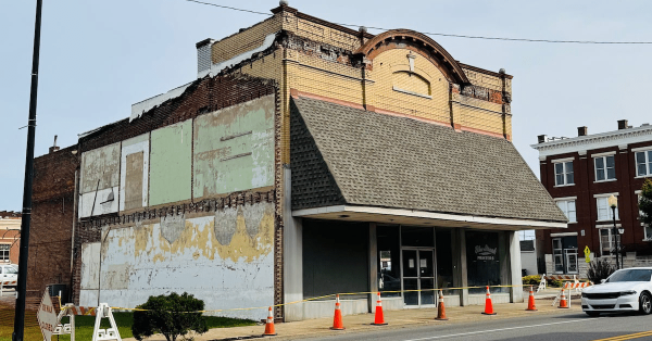 blue streak building with orange cones and caution tape out front