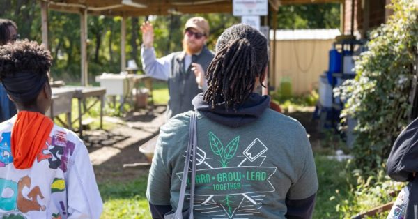 Back of person wearing Beginning Farmer Institute shirt