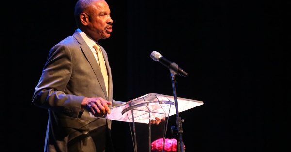 Hopkinsville Mayor Wendell Lynch serves as master of ceremonies during a celebration of life for his childhood friend Gloria Jean Watkins, who wrote under the pen name bell hooks, on Saturday, April 2, 2022, at the Alhambra Theatre. (Photo by Tony Kirves | Special to Hoptown Chronicle)