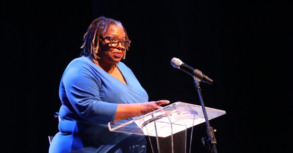 Kentucky Poet Laureate Crystal Wilkinson speaks during a celebration of Hopkinsville native Gloria Jean Watkins, who wrote under the pen name bell hooks, on Saturday, April 2, 2022, at the Alhambra Theatre in Hopkinsville. Wilkinson was just beginning her literary career when she met hooks in 1993. Earlier this year, Wilkinson received the NAACP Image Award for poetry. (Photo by Tony Kirves | Special to Hoptown Chronicle)