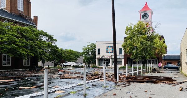 Storm debris, including wood from the roof of the Dallas Brawner Furniture Store (formerly Bill Beliles) is scattered across First Presbyterian Church and The Bus Stop lots on Ninth Street following a storm Wednesday afternoon, July 5, 2023. (Hoptown Chronicle photo by Jennifer P. Brown)