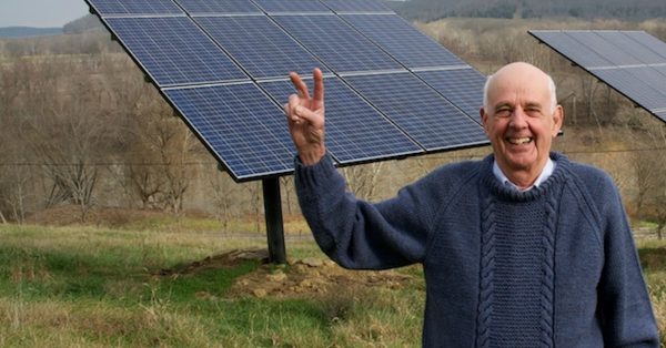 wendell berry next to solar panels