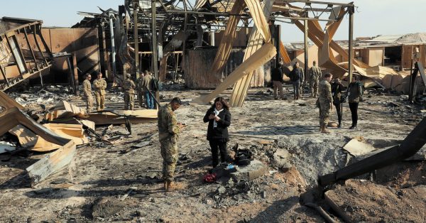 Members of the U.S. military and international media survey the damage of Iranian missile attacks at Al Asad Air Base, Iraq, Jan. 13, 2020. Alaska Air National Guardsmen of 211th Rescue Squadron evacuated many squadron members during the Jan. 8 attack. (U.S. Army photo by Spc. Derek Mustard/Released)