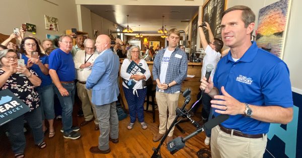 Democratic Gov. Andy Beshear addresses a group at Sixth & Main Coffeehouse in Shelbyville. (Kentucky Lantern photo by McKenna Horsley)