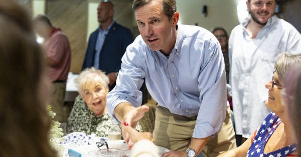 Gov. Andy Beshear shakes a supporter’s hand during the 26th annual Bean Dinner on Friday, Aug. 4, 2023. (Kentucky Lantern photo by Austin Anthony)