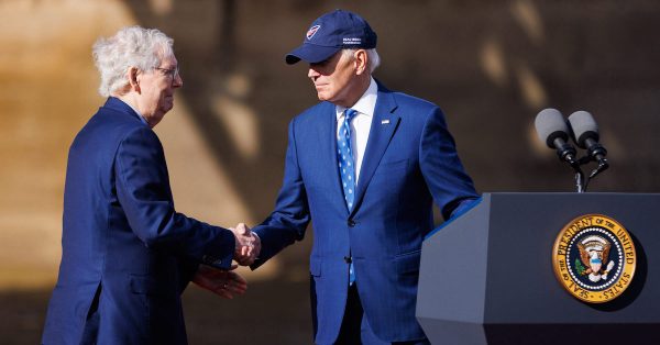 President Joe Biden shakes hands with Senate Minority Leader Mitch McConnell at an event in Covington on Wednesday, Jan. 4, 2023, celebrating federal funding of the Brent Spence Bridge Corridor Project. (Photo for the Kentucky Lantern by Michael Clubb)