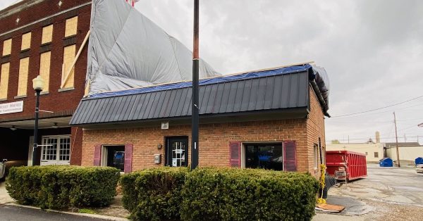 Big Fella'z, a small restaurant that sits adjacent to the Woody Winfree Fire and Transportation Museum in downtown Hopkinsville, was damaged by bricks blown out of the museum in the March 31 storm. (Hoptown Chronicle photo by Jennifer P. Brown)