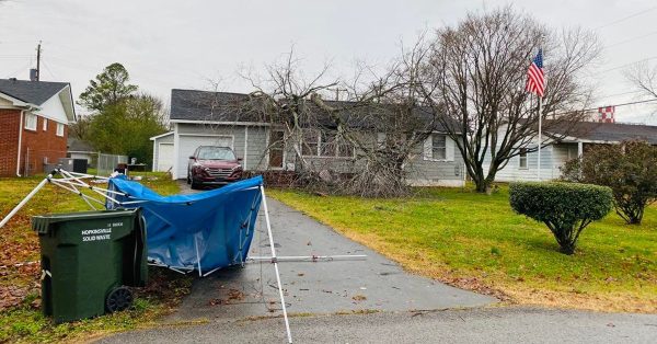 A fallen tree on top of a home is seen on Saturday, Dec. 11 on Calvin Street in Hopkinsville. (Photo by Jennifer P. Brown, Hoptown Chronicle)