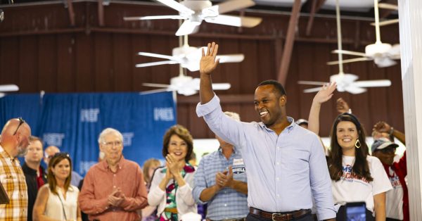 Daniel Cameron waves to the crowd during the 143rd Fancy Farm Picnic in 2023 when he was the state's attorney general and ran for governor. (Kentucky Lantern photo by Austin Anthony)