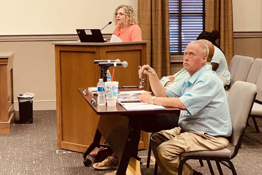 Mayor James R. Knight Jr. listens as city finance employee Melissa Clayton outlines the 2023-24 budget proposal for council members at a May 18, 2023, Committee of the Whole meeting. (Hoptown Chronicle photo by Jennifer P. Brown)